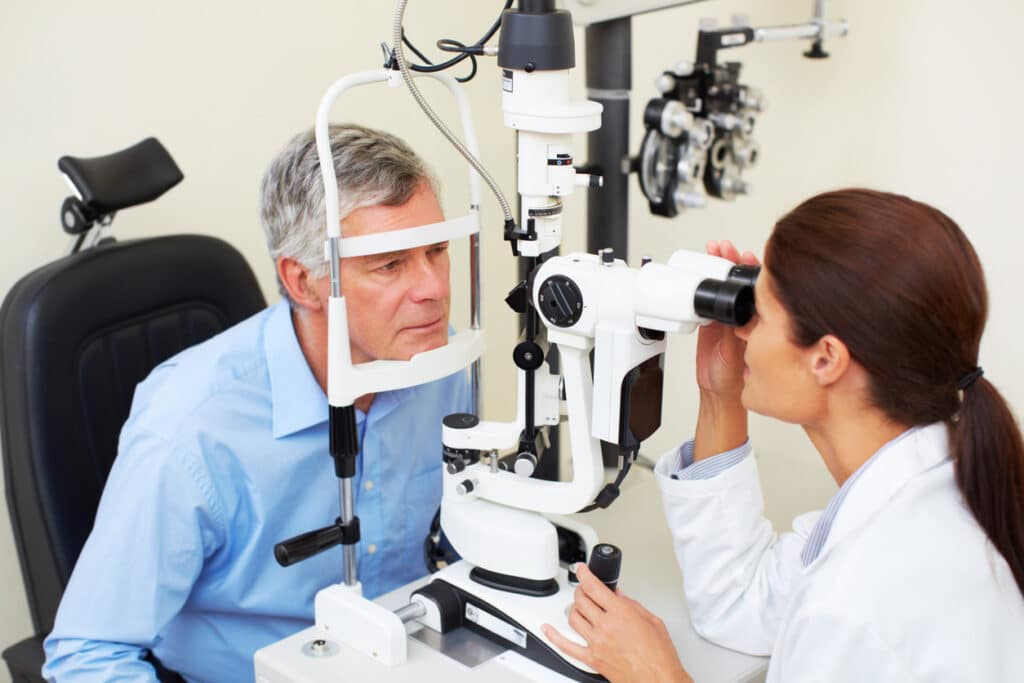 What Are the Early Signs of Keratoconus? 1 Patient undergoing a slit-lamp eye exam to evaluate corneal changes associated with keratoconus.