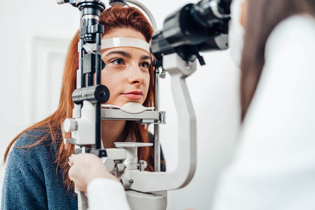 Can LASIK Correct Astigmatism? 1 Woman undergoing a slit-lamp eye exam as part of a LASIK evaluation for astigmatism.