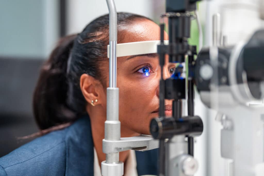 LASIK vs. PRK: What’s the Difference? 1 Patient undergoing a slit-lamp eye exam during an evaluation for LASIK or PRK vision correction.